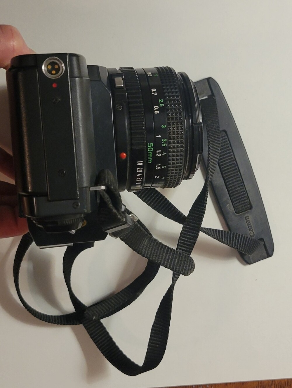 Canon black film camera with 50mm FD f/1.8 lens and neck strap - Picture 4 of 6